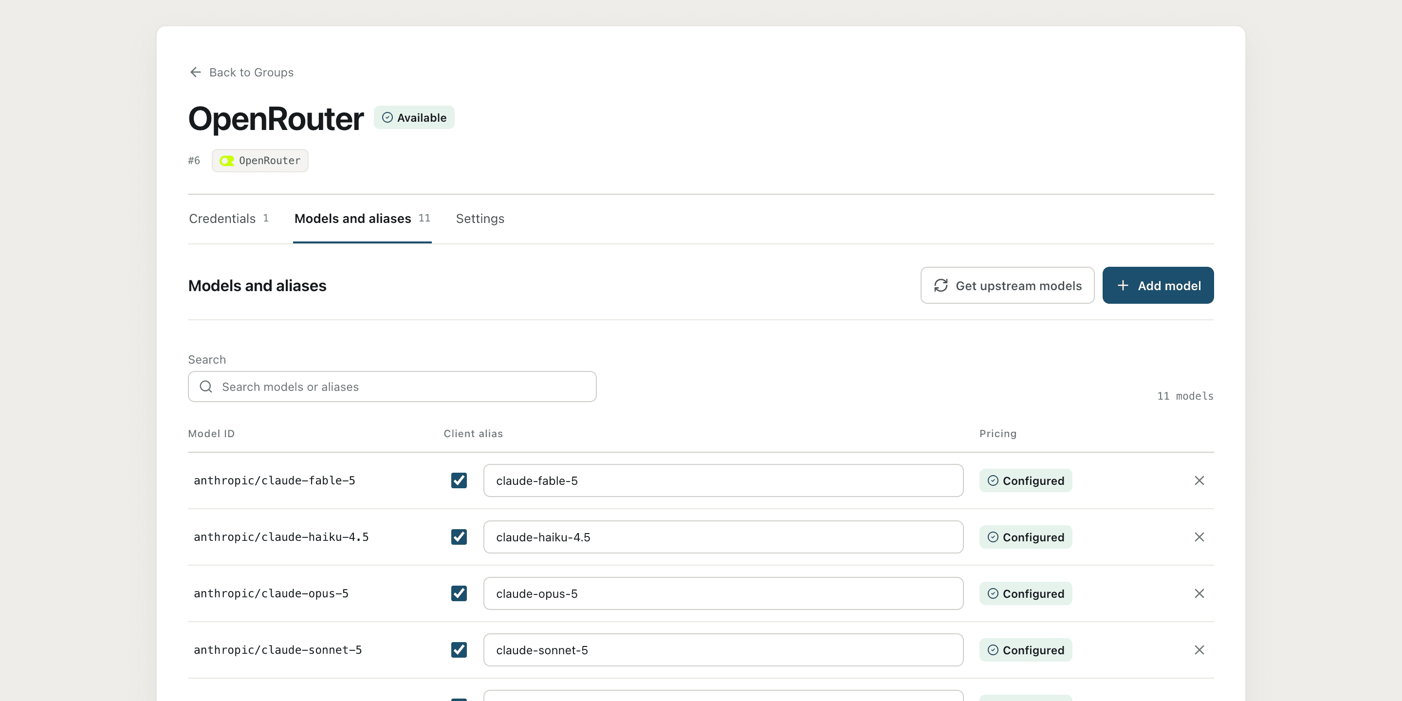 Group's Models and Aliases table, showing model ID, external alias, and pricing status